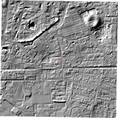 Shaded relief map of the ground around PO197DS, computed from Environment Agency LiDAR. The ground here sits at about 12 m above sea level and falls 9 m across the surrounding 800 m. Surface water reaching this point runs off ground lying to the north, 2.5 m higher.
