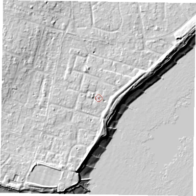 Shaded relief map of the ground around PO200TU, computed from Environment Agency LiDAR. The ground here sits at about 5 m above sea level and falls 11 m across the surrounding 800 m. Surface water reaching this point runs off ground lying to the south-west, 3.2 m higher.