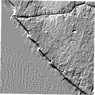 Shaded relief map of the ground around PO209HT, computed from Environment Agency LiDAR. The ground here sits at about 7 m above sea level and falls 11 m across the surrounding 800 m. Surface water reaching this point runs off ground lying to the west-north-west, 0.7 m higher.