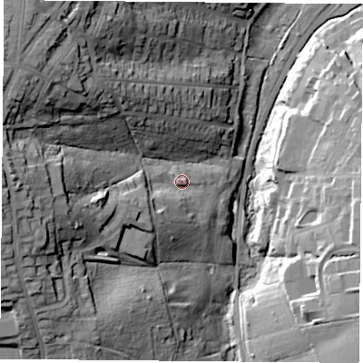 Shaded relief map of the ground around PO332TR, computed from Environment Agency LiDAR. The ground here sits at about 18 m above sea level and falls 49 m across the surrounding 800 m. Surface water reaching this point runs off ground lying to the west-south-west, 12.6 m higher.