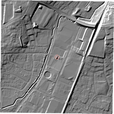 Shaded relief map of the ground around PO92NF, computed from Environment Agency LiDAR. The ground here sits at about 18 m above sea level and falls 20 m across the surrounding 800 m. Surface water reaching this point runs off ground lying to the east-north-east, 15.8 m higher.
