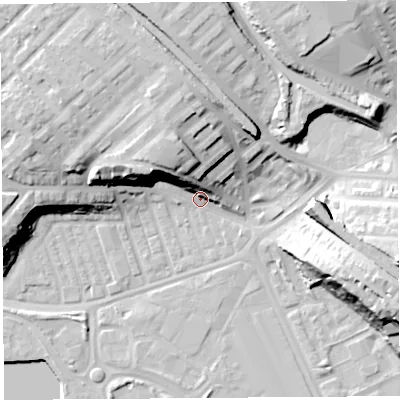 Shaded relief map of the ground around PR21AQ, computed from Environment Agency LiDAR. The ground here sits at about 9 m above sea level and falls 24 m across the surrounding 800 m. Surface water reaching this point runs off ground lying to the north-north-west, 18.8 m higher.