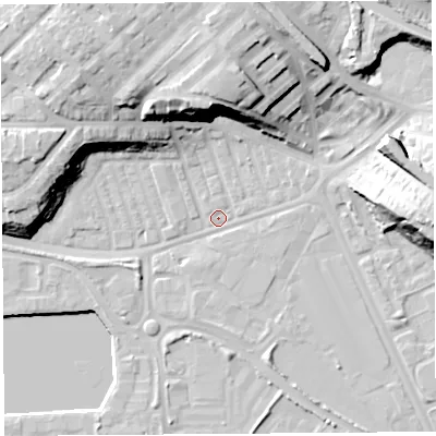 Shaded relief map of the ground around PR21AX, computed from Environment Agency LiDAR. The ground here sits at about 7 m above sea level and falls 23 m across the surrounding 800 m. Surface water reaching this point runs off ground lying to the north, 20.4 m higher.