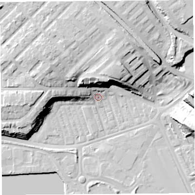 Shaded relief map of the ground around PR21BN, computed from Environment Agency LiDAR. The ground here sits at about 9 m above sea level and falls 24 m across the surrounding 800 m. Surface water reaching this point runs off ground lying to the north, 19.4 m higher.