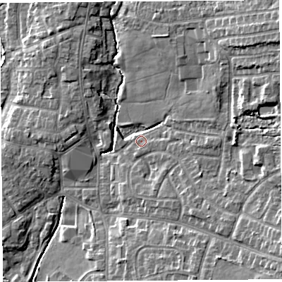Shaded relief map of the ground around PR251HY, computed from Environment Agency LiDAR. The ground here sits at about 18 m above sea level and falls 13 m across the surrounding 800 m. Surface water reaching this point runs off ground lying to the north-east, 9.8 m higher.