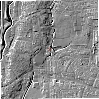Shaded relief map of the ground around PR251UR, computed from Environment Agency LiDAR. The ground here sits at about 18 m above sea level and falls 12 m across the surrounding 800 m. Surface water reaching this point runs off ground lying to the east-north-east, 9.2 m higher.