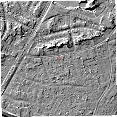 Shaded relief map of the ground around PR83HN, computed from Environment Agency LiDAR. The ground here sits at about 11 m above sea level and falls 12 m across the surrounding 800 m. Surface water reaching this point runs off ground lying to the north, 5.0 m higher.