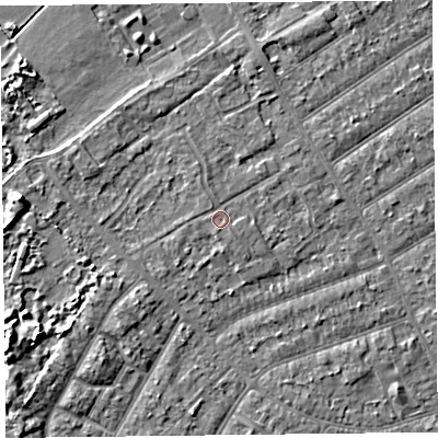 Shaded relief map of the ground around PR99QS, computed from Environment Agency LiDAR. The ground here sits at about 6 m above sea level and falls 6 m across the surrounding 800 m. The ground contributing surface water to this point lies to the south.