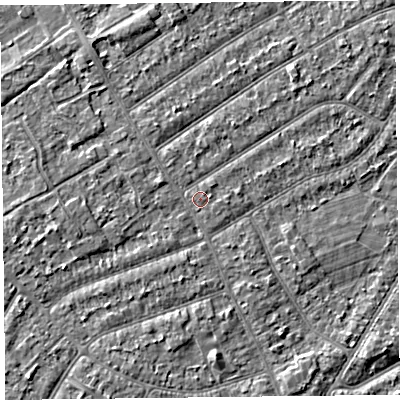 Shaded relief map of the ground around PR99ST, computed from Environment Agency LiDAR. The ground here sits at about 6 m above sea level and falls 2 m across the surrounding 800 m. The ground contributing surface water to this point lies to the east-north-east.