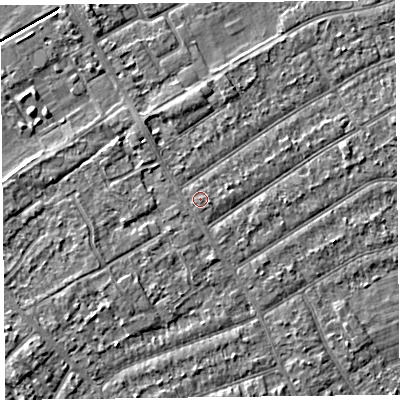 Shaded relief map of the ground around PR99TG, computed from Environment Agency LiDAR. The ground here sits at about 6 m above sea level and falls 3 m across the surrounding 800 m. The ground contributing surface water to this point lies to the south.