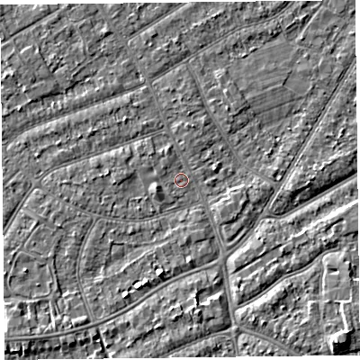 Shaded relief map of the ground around PR99TJ, computed from Environment Agency LiDAR. The ground here sits at about 6 m above sea level and falls 5 m across the surrounding 800 m. Surface water reaching this point runs off ground lying to the west, 1.1 m higher.