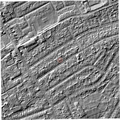 Shaded relief map of the ground around PR99US, computed from Environment Agency LiDAR. The ground here sits at about 6 m above sea level and falls 2 m across the surrounding 800 m. Surface water reaching this point runs off ground lying to the west-south-west, 1.1 m higher.