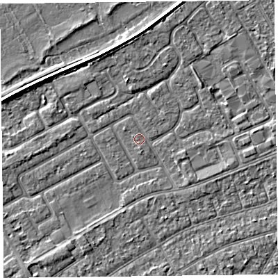 Shaded relief map of the ground around PR99XD, computed from Environment Agency LiDAR. The ground here sits at about 5 m above sea level and falls 3 m across the surrounding 800 m. Surface water reaching this point runs off ground lying to the north-north-west, 2.3 m higher.