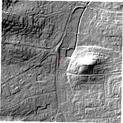 Shaded relief map of the ground around RG122NG, computed from Environment Agency LiDAR. The ground here sits at about 64 m above sea level and falls 23 m across the surrounding 800 m. Surface water reaching this point runs off ground lying to the east, 15.7 m higher.