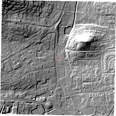 Shaded relief map of the ground around RG122NQ, computed from Environment Agency LiDAR. The ground here sits at about 64 m above sea level and falls 22 m across the surrounding 800 m. Surface water reaching this point runs off ground lying to the east, 11.9 m higher.