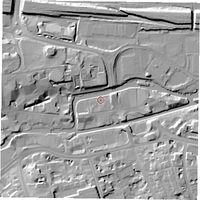 Shaded relief map of the ground around RG13JA, computed from Environment Agency LiDAR. The ground here sits at about 37 m above sea level and falls 11 m across the surrounding 800 m. Surface water reaching this point runs off ground lying to the east-north-east, 2.6 m higher.