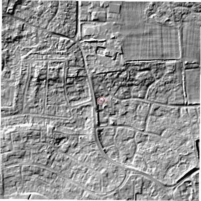 Shaded relief map of the ground around RG194FA, computed from Environment Agency LiDAR. The ground here sits at about 69 m above sea level and falls 12 m across the surrounding 800 m. Surface water reaching this point runs off ground lying to the north, 5.6 m higher.