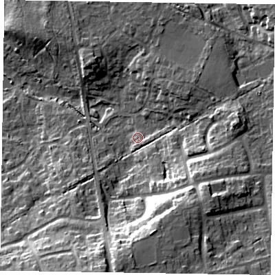 Shaded relief map of the ground around RG456TE, computed from Environment Agency LiDAR. The ground here sits at about 68 m above sea level and falls 19 m across the surrounding 800 m. Surface water reaching this point runs off ground lying to the east, 9.5 m higher.