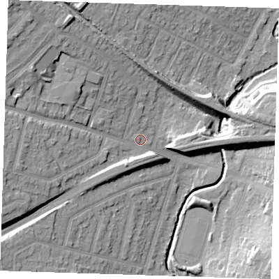 Shaded relief map of the ground around RM113XH, computed from Environment Agency LiDAR. The ground here sits at about 15 m above sea level and falls 25 m across the surrounding 800 m. Surface water reaching this point runs off ground lying to the west, 13.5 m higher.