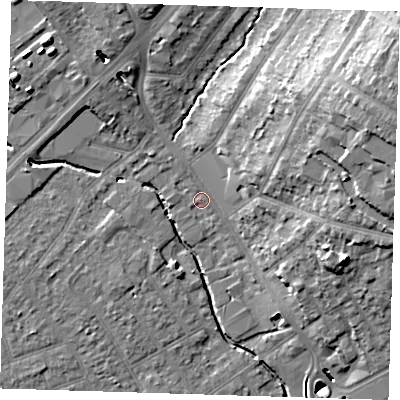 Shaded relief map of the ground around RM11DT, computed from Environment Agency LiDAR. The ground here sits at about 16 m above sea level and falls 21 m across the surrounding 800 m. Surface water reaching this point runs off ground lying to the east-north-east, 16.7 m higher.