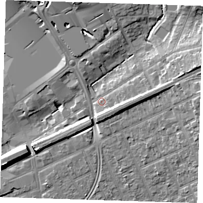 Shaded relief map of the ground around RM13QF, computed from Environment Agency LiDAR. The ground here sits at about 18 m above sea level and falls 15 m across the surrounding 800 m. Surface water reaching this point runs off ground lying to the east, 7.2 m higher.