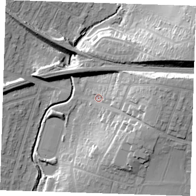 Shaded relief map of the ground around RM142QU, computed from Environment Agency LiDAR. The ground here sits at about 13 m above sea level and falls 25 m across the surrounding 800 m. Surface water reaching this point runs off ground lying to the east, 18.7 m higher.