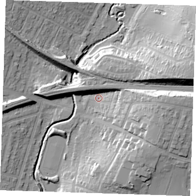 Shaded relief map of the ground around RM142RA, computed from Environment Agency LiDAR. The ground here sits at about 12 m above sea level and falls 25 m across the surrounding 800 m. Surface water reaching this point runs off ground lying to the east, 19.5 m higher.