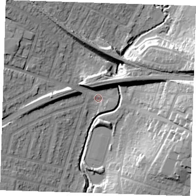 Shaded relief map of the ground around RM142RB, computed from Environment Agency LiDAR. The ground here sits at about 11 m above sea level and falls 21 m across the surrounding 800 m. Surface water reaching this point runs off ground lying to the east-north-east, 18.4 m higher.