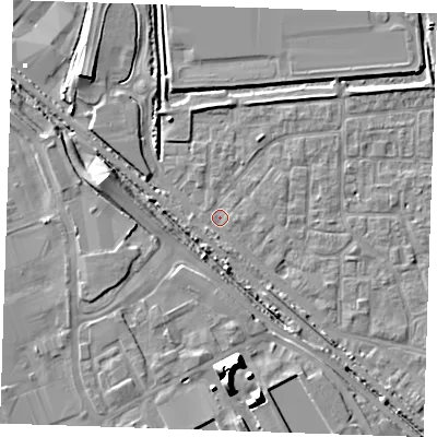 Shaded relief map of the ground around RM187AE, computed from Environment Agency LiDAR. The ground here sits at about 0 m above sea level and falls 12 m across the surrounding 800 m. Surface water reaching this point runs off ground lying to the south, 12.0 m higher.