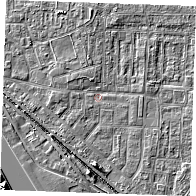 Shaded relief map of the ground around RM187QZ, computed from Environment Agency LiDAR. The ground here sits at about 0 m above sea level and falls 16 m across the surrounding 800 m. Surface water reaching this point runs off ground lying to the south, 4.2 m higher.