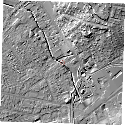 Shaded relief map of the ground around RM77DJ, computed from Environment Agency LiDAR. The ground here sits at about 15 m above sea level and falls 19 m across the surrounding 800 m. Surface water reaching this point runs off ground lying to the north-east, 17.9 m higher.