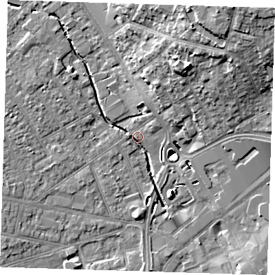 Shaded relief map of the ground around RM77DL, computed from Environment Agency LiDAR. The ground here sits at about 15 m above sea level and falls 19 m across the surrounding 800 m. Surface water reaching this point runs off ground lying to the north-east, 18.6 m higher.