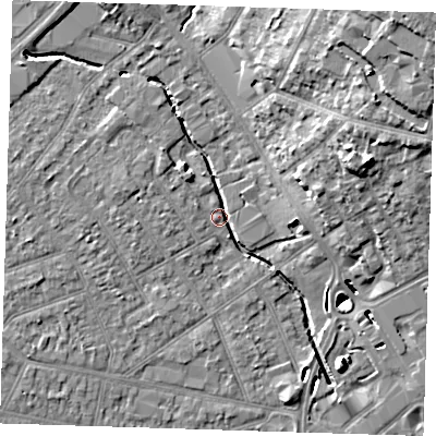 Shaded relief map of the ground around RM77EE, computed from Environment Agency LiDAR. The ground here sits at about 15 m above sea level and falls 20 m across the surrounding 800 m. Surface water reaching this point runs off ground lying to the north-east, 19.3 m higher.