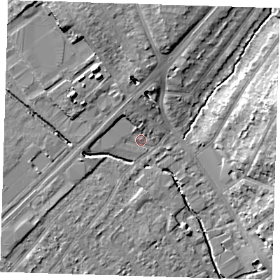 Shaded relief map of the ground around RM77JP, computed from Environment Agency LiDAR. The ground here sits at about 16 m above sea level and falls 14 m across the surrounding 800 m. Surface water reaching this point runs off ground lying to the north, 4.9 m higher.