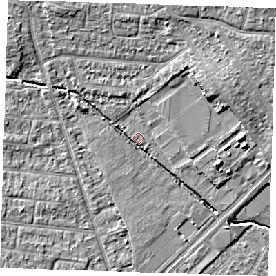 Shaded relief map of the ground around RM77LS, computed from Environment Agency LiDAR. The ground here sits at about 18 m above sea level and falls 10 m across the surrounding 800 m. Surface water reaching this point runs off ground lying to the north-west, 5.9 m higher.