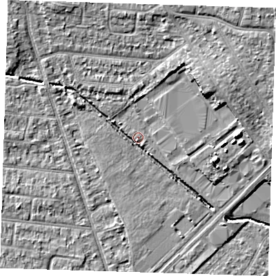 Shaded relief map of the ground around RM77NT, computed from Environment Agency LiDAR. The ground here sits at about 18 m above sea level and falls 10 m across the surrounding 800 m. Surface water reaching this point runs off ground lying to the north-west, 5.9 m higher.