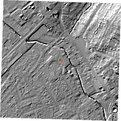 Shaded relief map of the ground around RM77PJ, computed from Environment Agency LiDAR. The ground here sits at about 16 m above sea level and falls 18 m across the surrounding 800 m. Surface water reaching this point runs off ground lying to the west-south-west, 1.7 m higher.