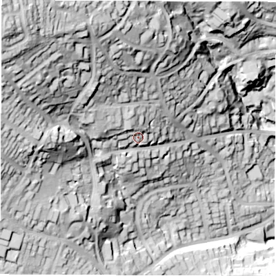 Shaded relief map of the ground around S103PR, computed from Environment Agency LiDAR. The ground here sits at about 215 m above sea level and falls 104 m across the surrounding 800 m. Surface water reaching this point runs off ground lying to the west-north-west, 12.5 m higher.