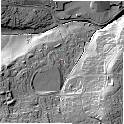 Shaded relief map of the ground around S207HE, computed from Environment Agency LiDAR. The ground here sits at about 65 m above sea level and falls 40 m across the surrounding 800 m. Surface water reaching this point runs off ground lying to the west-south-west, 7.4 m higher.