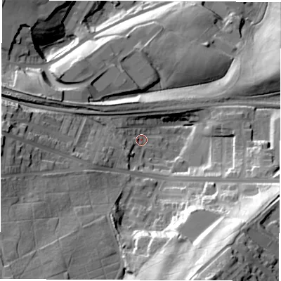 Shaded relief map of the ground around S703QT, computed from Environment Agency LiDAR. The ground here sits at about 74 m above sea level and falls 63 m across the surrounding 800 m. Surface water reaching this point runs off ground lying to the south-south-east, 52.5 m higher.