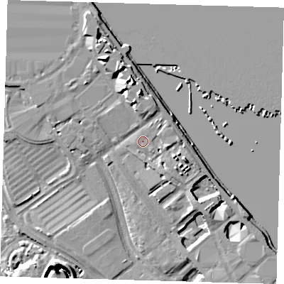 Shaded relief map of the ground around SE100FR, computed from Environment Agency LiDAR. The ground here sits at about 5 m above sea level and falls 13 m across the surrounding 800 m. Surface water reaching this point runs off ground lying to the east-south-east, 4.6 m higher.