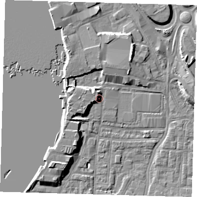 Shaded relief map of the ground around SE100TL, computed from Environment Agency LiDAR. The ground here sits at about 5 m above sea level and falls 9 m across the surrounding 800 m. Surface water reaching this point runs off ground lying to the west-south-west, 4.1 m higher.
