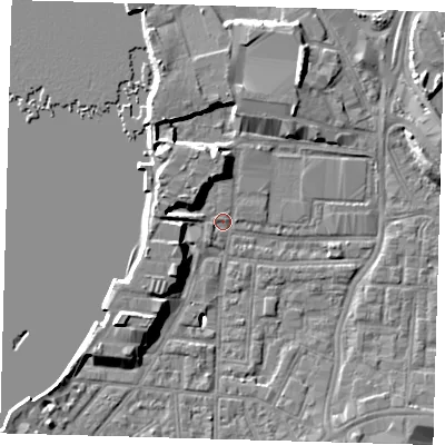 Shaded relief map of the ground around SE100TT, computed from Environment Agency LiDAR. The ground here sits at about 2 m above sea level and falls 9 m across the surrounding 800 m. Surface water reaching this point runs off ground lying to the south-west, 8.9 m higher.