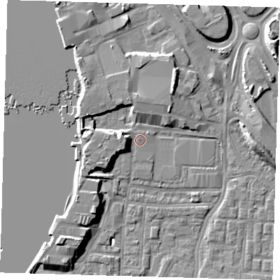 Shaded relief map of the ground around SE100XH, computed from Environment Agency LiDAR. The ground here sits at about 2 m above sea level and falls 9 m across the surrounding 800 m. Surface water reaching this point runs off ground lying to the west-south-west, 4.1 m higher.