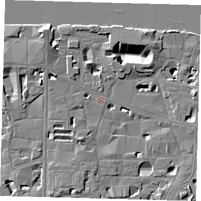 Shaded relief map of the ground around SE10JE, computed from Environment Agency LiDAR. The ground here sits at about 4 m above sea level and falls 16 m across the surrounding 800 m. Surface water reaching this point runs off ground lying to the north-west, 12.2 m higher.