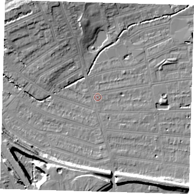 Shaded relief map of the ground around SE128LS, computed from Environment Agency LiDAR. The ground here sits at about 15 m above sea level and falls 15 m across the surrounding 800 m. Surface water reaching this point runs off ground lying to the north-north-west, 10.6 m higher.