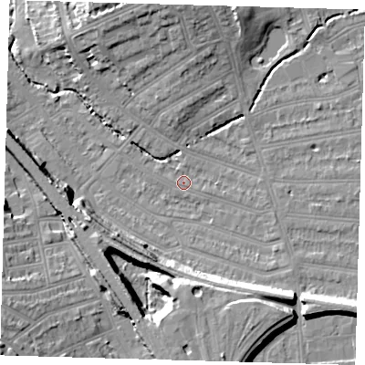 Shaded relief map of the ground around SE135LX, computed from Environment Agency LiDAR. The ground here sits at about 14 m above sea level and falls 18 m across the surrounding 800 m. Surface water reaching this point runs off ground lying to the north, 9.0 m higher.