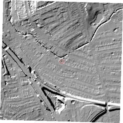 Shaded relief map of the ground around SE135LY, computed from Environment Agency LiDAR. The ground here sits at about 13 m above sea level and falls 18 m across the surrounding 800 m. Surface water reaching this point runs off ground lying to the north, 10.7 m higher.
