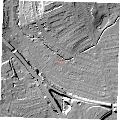Shaded relief map of the ground around SE135LZ, computed from Environment Agency LiDAR. The ground here sits at about 13 m above sea level and falls 19 m across the surrounding 800 m. Surface water reaching this point runs off ground lying to the north-north-east, 11.7 m higher.