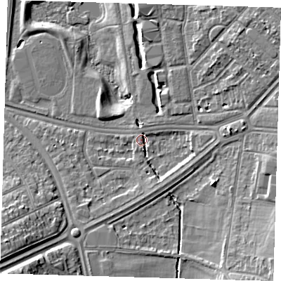Shaded relief map of the ground around SE95LN, computed from Environment Agency LiDAR. The ground here sits at about 24 m above sea level and falls 14 m across the surrounding 800 m. Surface water reaching this point runs off ground lying to the east, 3.6 m higher.